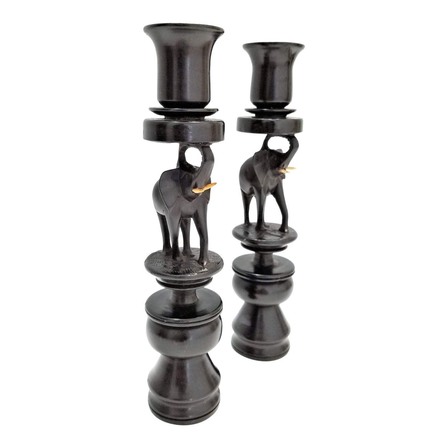 A pair of Ebony Elephant Candle Holders