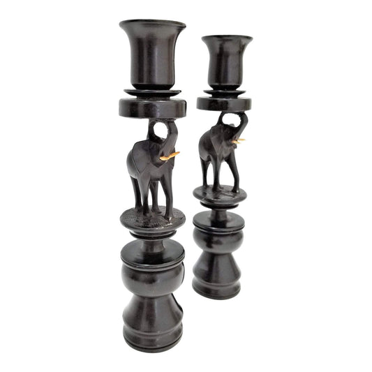 A pair of Ebony Elephant Candle Holders