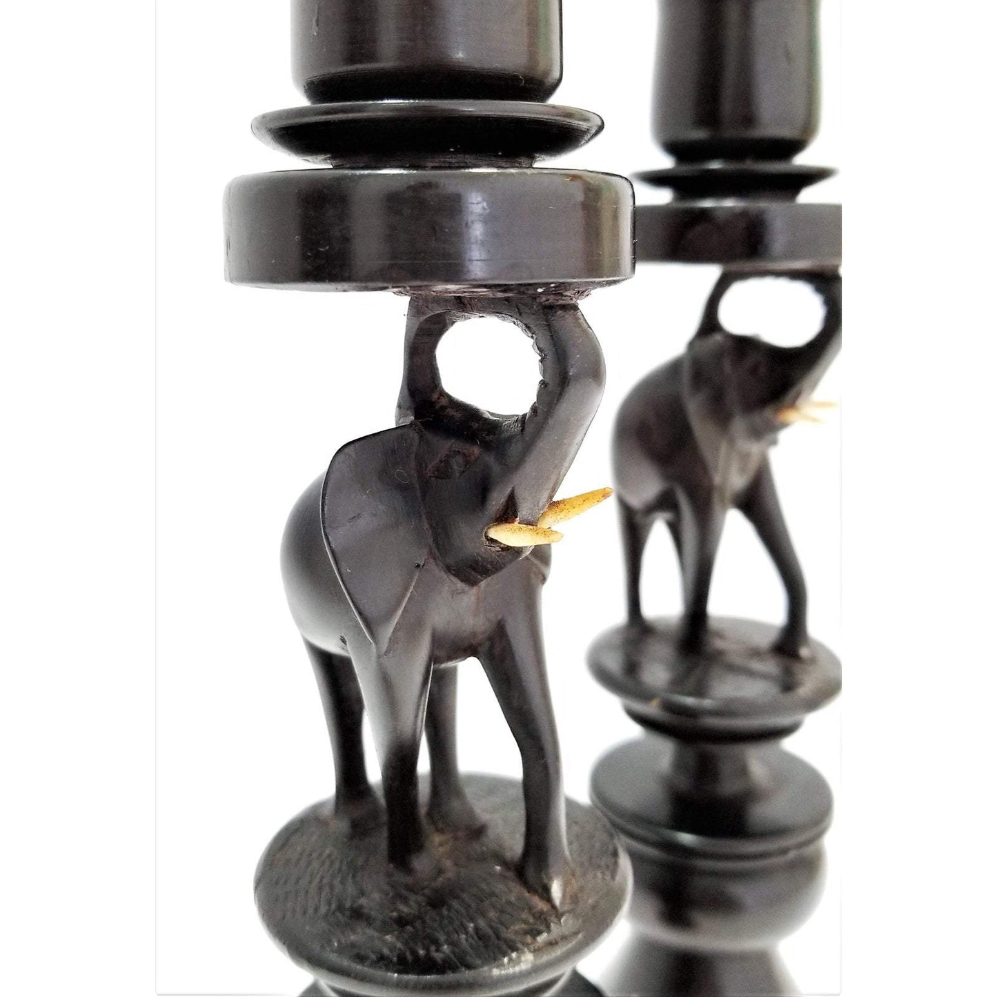 A pair of Ebony Elephant Candle Holders