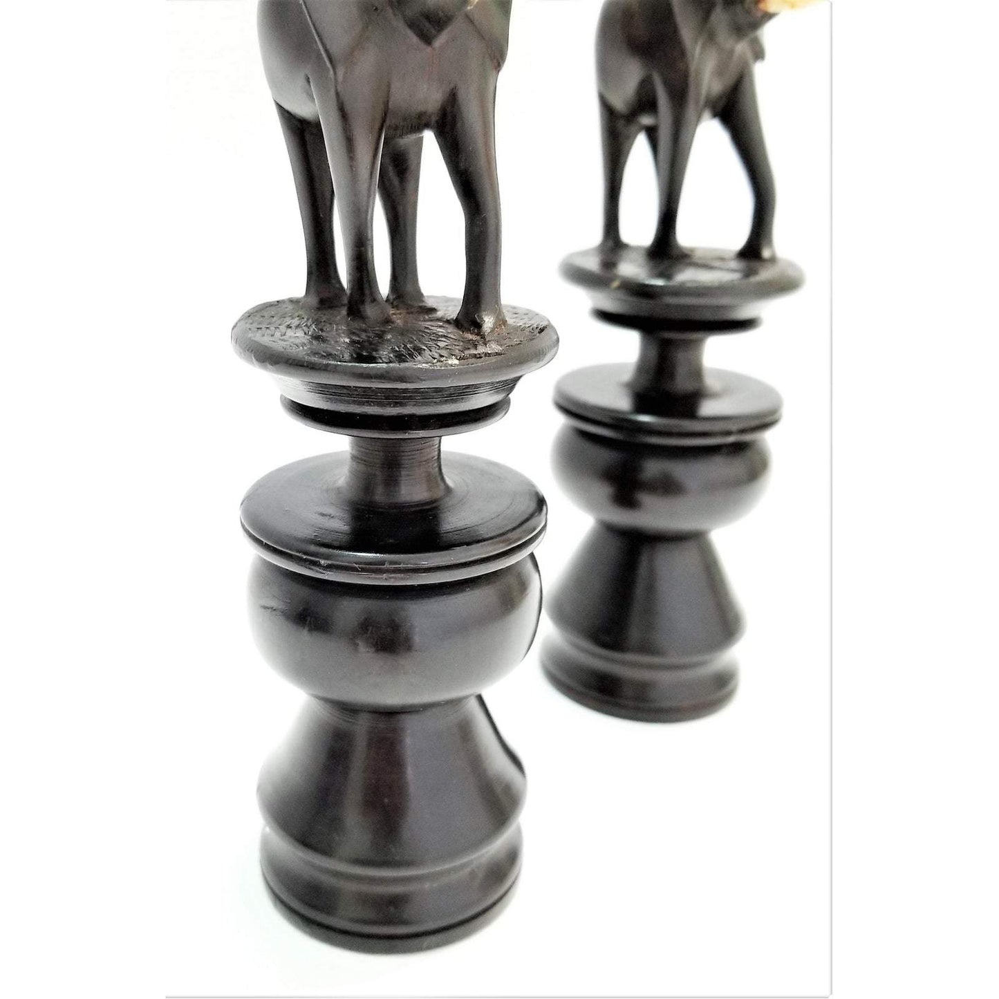 A pair of Ebony Elephant Candle Holders