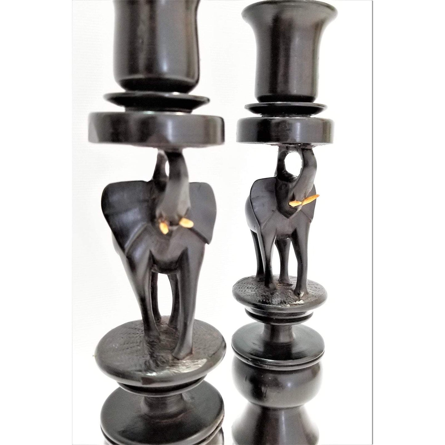 A pair of Ebony Elephant Candle Holders